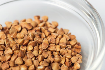 Plate of buckwheat on white table