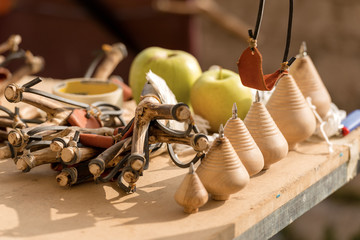 Vintage wooden toys - Group of handmade slingshots and spinning tops