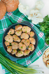 Cauliflower breaded in a pan. Dishes from cabbage. Light wooden background. Proper nutrition. Healthy breakfast. Dinner table. Healthy food balance. Close-up.