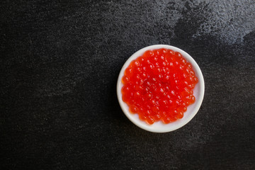 red caviar (seafood, salmon caviar) menu concept. food background. top view. copy space