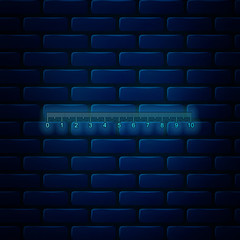 Fototapeta premium Glowing neon Measuring scale, markup for rulers icon isolated on brick wall background. Size indicators. Different unit distances. Vector Illustration