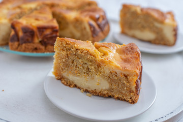 home made carrot cake cheesecake on a table