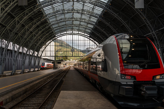 Train waiting at the railway station with the mountain landscape view on the background