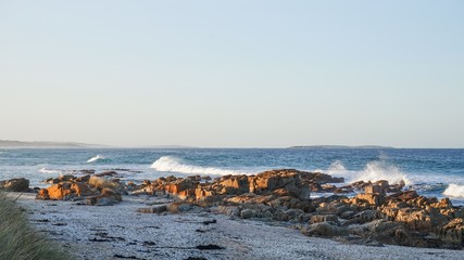 the spectacular red rocks bays of fire in tasmania, australia