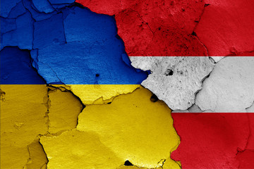 flags of Ukraine and Austria painted on cracked wall