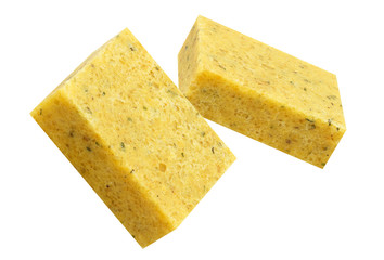Close-up of two bouillon cubes in the air, isolated on white background