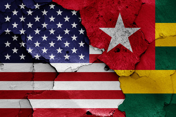 flags of USA and Togo painted on cracked wall