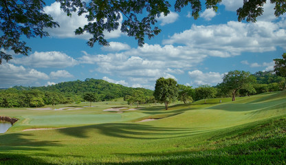 Fototapeta na wymiar A beautiful golf course in lush tropical setting