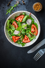  Healthy salad, leaves mix salad (mix micro greens, cucumber, tomato, onion, other ingredients). food background. copy space