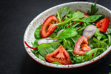  Healthy salad, leaves mix salad (mix micro greens, cucumber, tomato, onion, other ingredients). food background. copy space