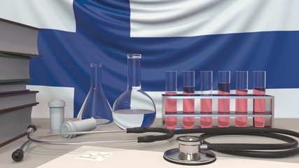 Clinic laboratory equipment on Finnish flag background. Healthcare and medical research in Finland related conceptual 3D rendering