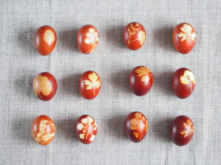 Easter. Traditional onion-peeled eggs on a canvas tablecloth. Arranged in synchronous order. We...