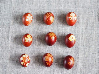 Easter. Traditional onion-peeled eggs on a canvas tablecloth. Arranged in synchronous order. We...