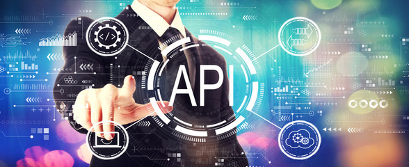 API - application programming interface concept API concept with a businessman on a shiny background