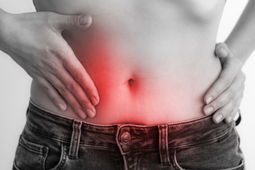 Woman touching stomach painful suffering from stomachache causes of menstruation period, gastric ulcer, appendicitis or gastrointestinal system disease. Healthcare and health insurance concept