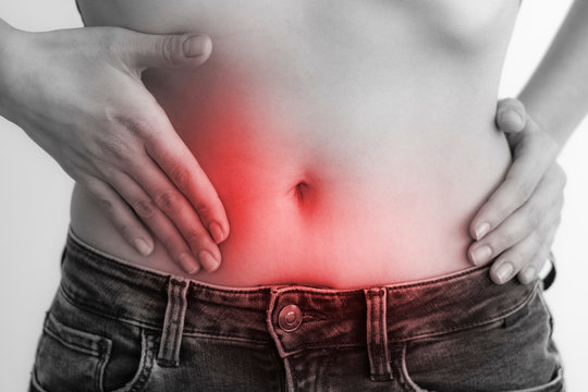 Woman touching stomach painful suffering from stomachache causes of menstruation period, gastric ulcer, appendicitis or gastrointestinal system disease. Healthcare and health insurance concept