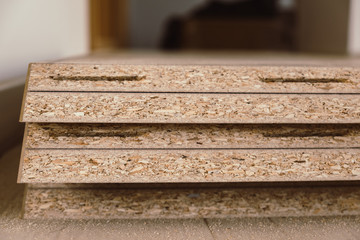 Wooden texture chipboard boards cut and prepared for installation
