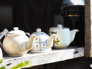 Fototapeta na wymiar vintage tea pot on old wooden table.