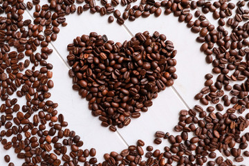 Background from coffee beans and heart made from coffee