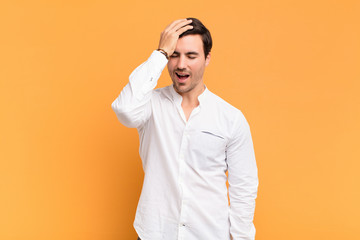  laughing and slapping forehead like saying d‚Äôoh! I forgot or that was a stupid mistake