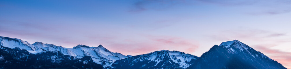 Naklejka na ściany i meble Alps in the pink light of sunrise.