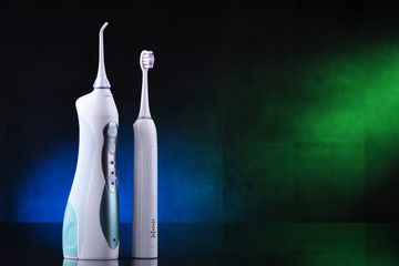 Oral irrigator and electric sonic toothbrush