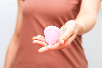 Menstrual Cup in the hands of a girl