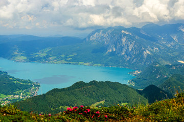 Fototapeta premium Panoramic view from Schafberg monutain to lake Attersee, Austrian Alps, next to Sankt Wolfgang im Salzkammergut