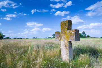 Stone tomb crosses on an ancient Christian necropolis of the 17th-19th centuries. The steppe hills...