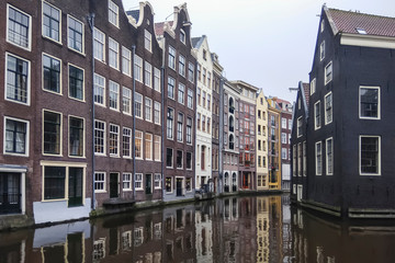 Fototapeta premium Old houses of Amsterdam, standing on the Keizersgracht canal, a picturesque old street, Netherlands, Holland