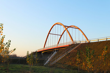 Rzeszow, Poland - 9 9 2018: Suspended road bridge across the autobahn. Metal construction technological structure. Modern architecture
