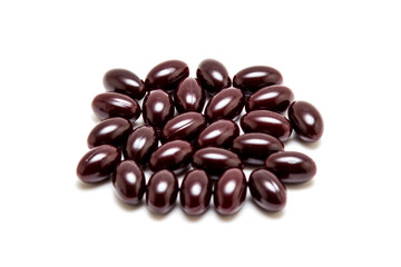 Chocolates in chocolate glaze isolated on white