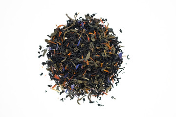a mixture of black and green tea with the addition of cornflower and tea rose petals. dry tea leaves on a white background top view.
