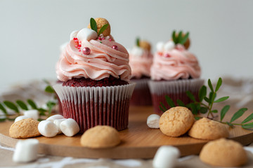 cupcakes with cream and sprinkles