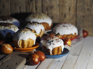Easter. Traditional Easter pastries, painted onion peel eggs on a natural tablecloth. Night dark shots. Sprinkled with natural ingredients. Wooden ancient background. We celebrate the holiday.