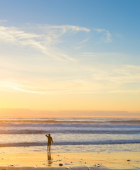 Fototapeta na wymiar Surfer ocean beach sunset background