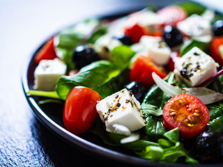 Fresh greek salad - feta cheese, tomato, lettuce, black olives and onion