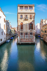 Fototapeta na wymiar Beautiful building and architecture along romantic canal in Venice, Italy