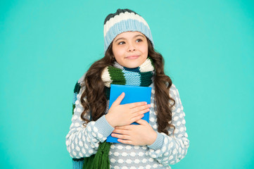 thoughtful little book lover. cosy and comfort concept. my favorite story. leisure in winter time. childhood development. Girl reading book. smart kid study. back to school. winter story reading