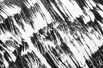 Patterns of white paint from a brush on a black background