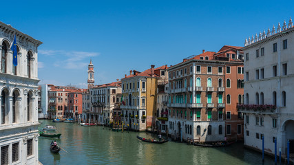 Fototapeta na wymiar Venice/ Italy . View of Venice Streets, canals, bridges, boats, gondolas. Biennale. Colorful Old Authentic Buildings in Venice. Ancient Italian city. Travel in Europe. Tourism Concept. 
