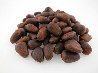 Pine nuts close up isolate on white background