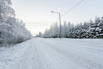 Obraz premium The road number 496 has covered with heavy snow in winter season at Lapland, Finland.