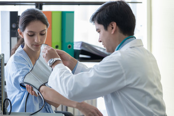 Obraz premium A doctor take care of sick patient woman at the hospital or medical clinic.