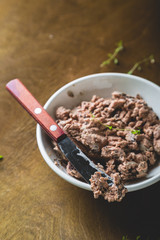 Pate with fresh bread on a wooden table