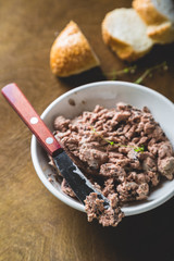 Pate with fresh bread on a wooden table