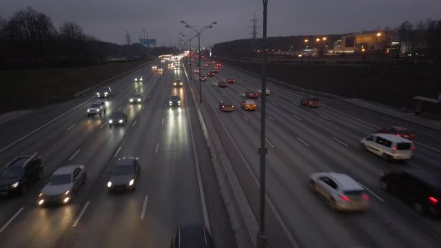 MKAD, cars go on the expressway in the evening. The track around Moscow