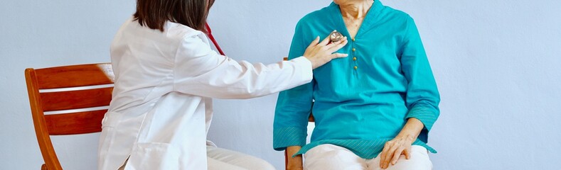 A woman doctor use stethoscope to listen to the lung of the patient who have a lung disease