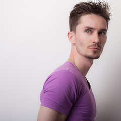 Handsome young elegant man studio portrait.