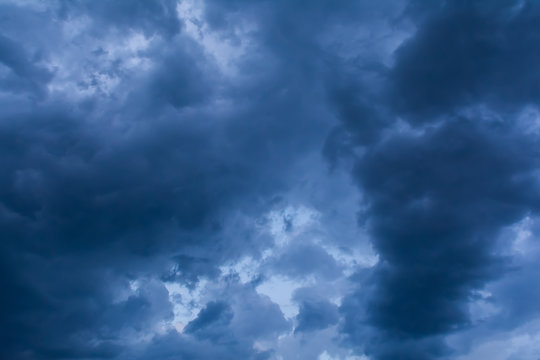 Dramatic cloudscape sky background with dark blue clouds, storm